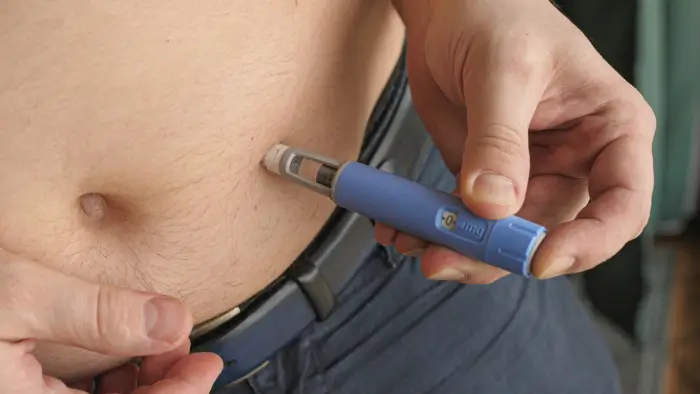 A person using a similar injection like Entyvio.