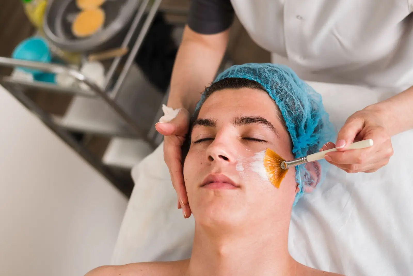 A man laying in bed getting the PRX-T33 treatment.
